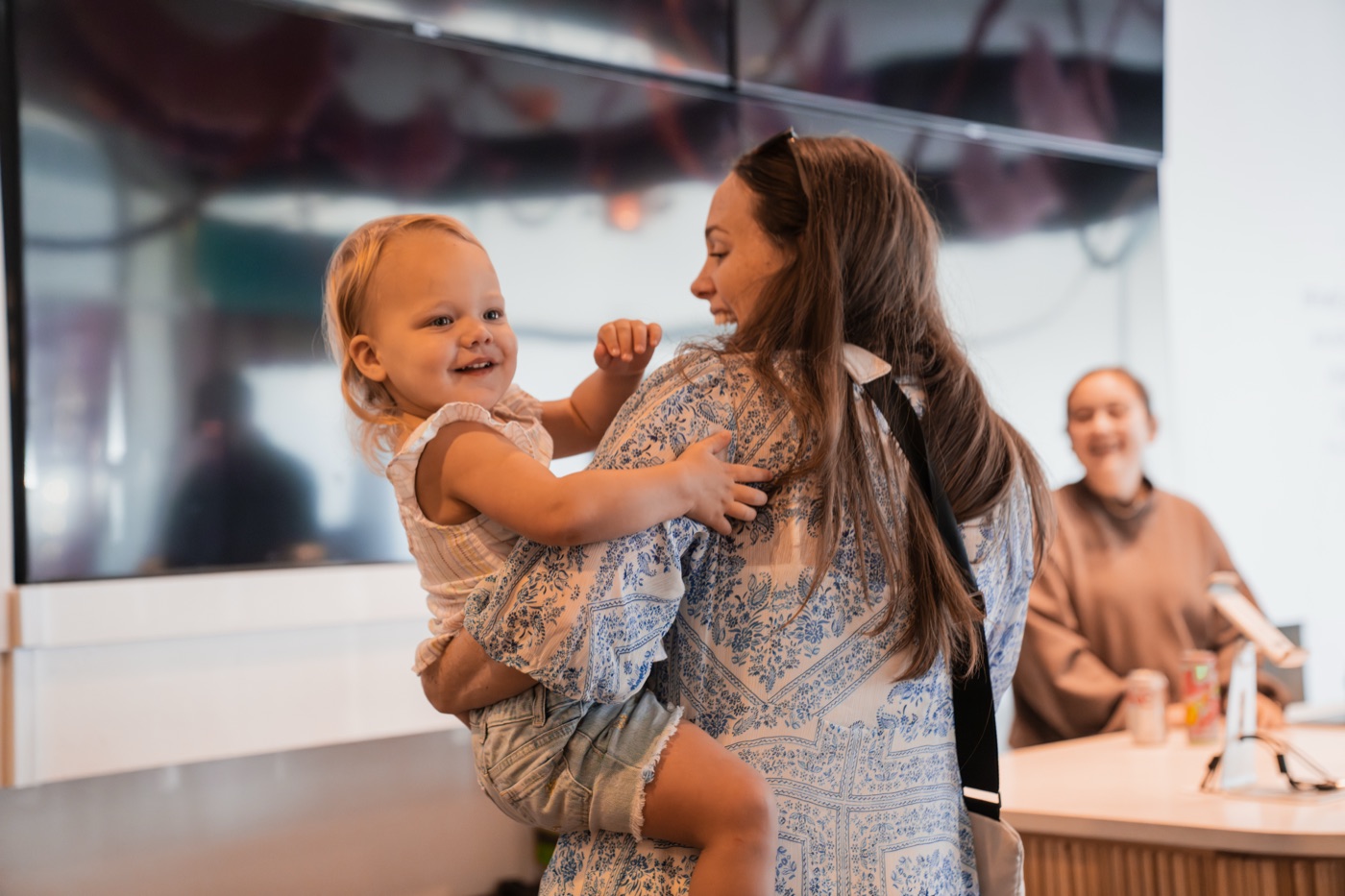 A family at CityKids check-in