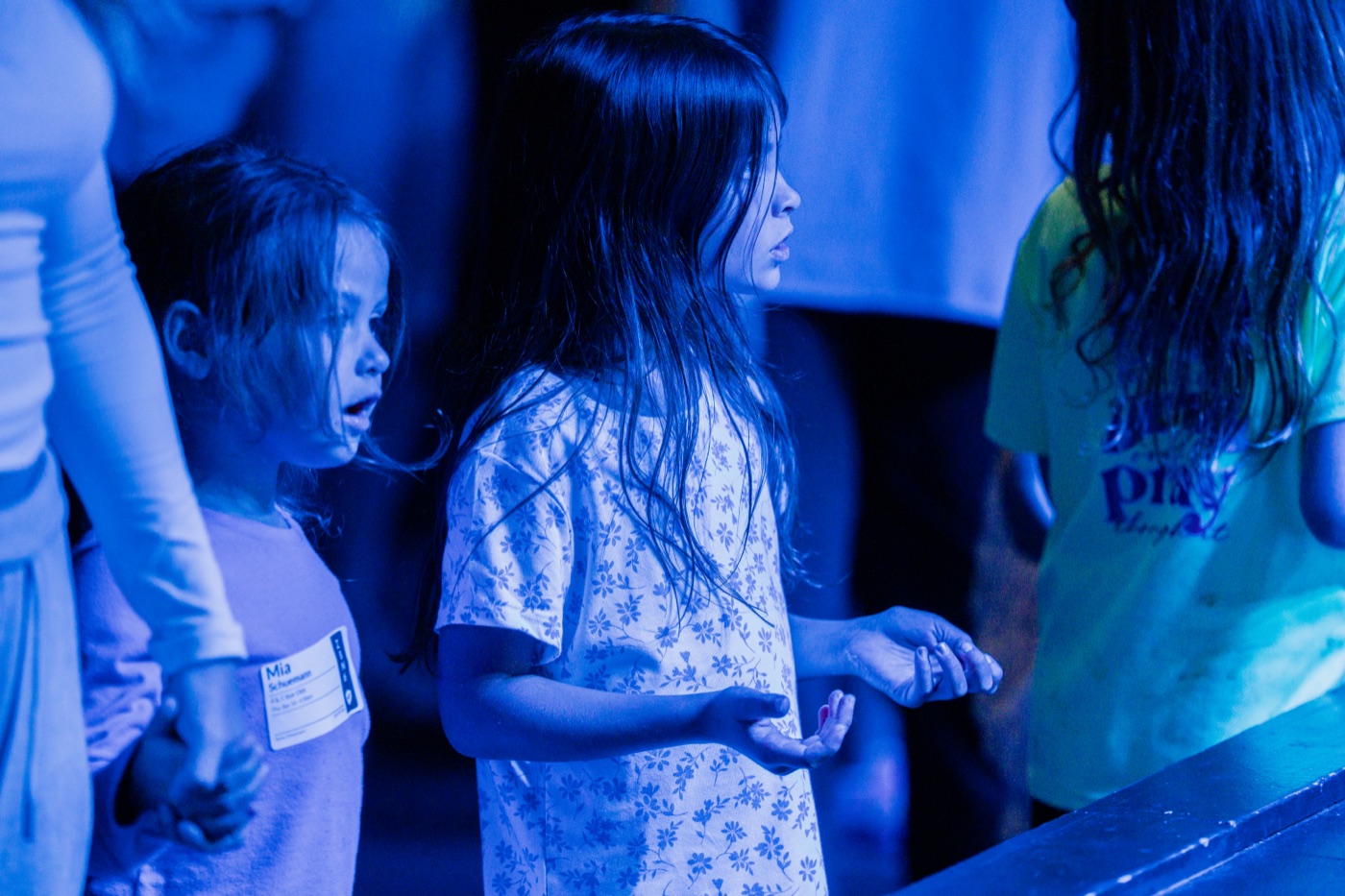 Kids in a worship moment at CityKids