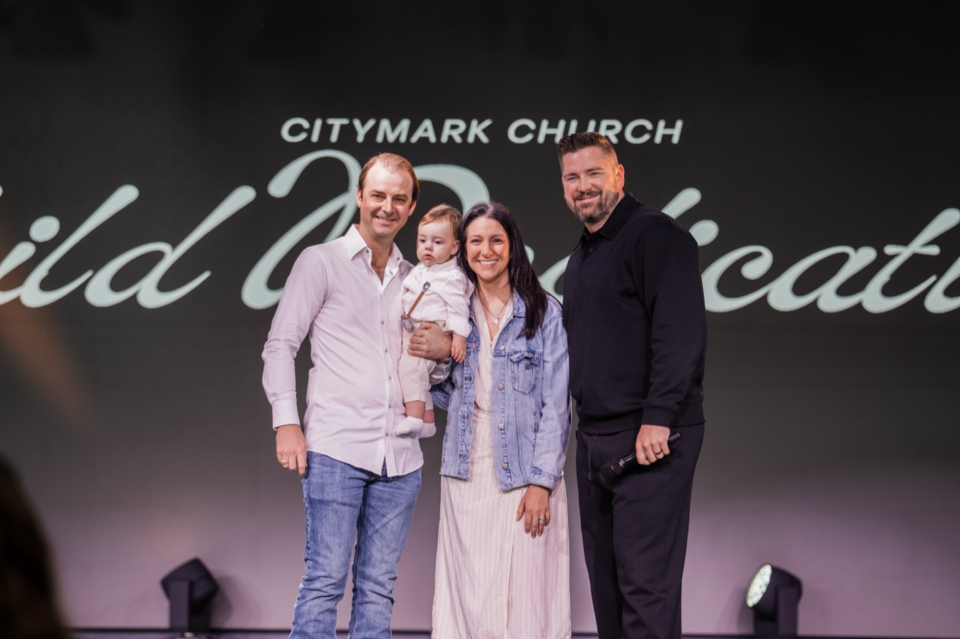Family on stage at Citymark Child Dedication