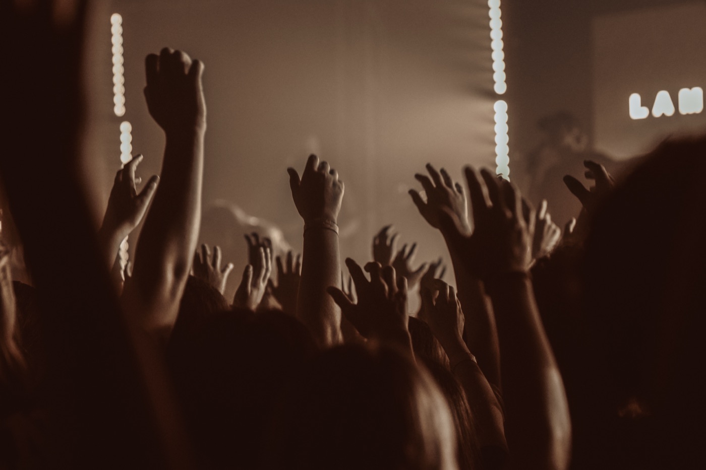 Hands raised in worship at CYC