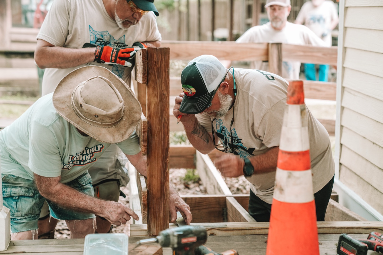 Citymark volunteers building a wheelchair ramp during For The City week